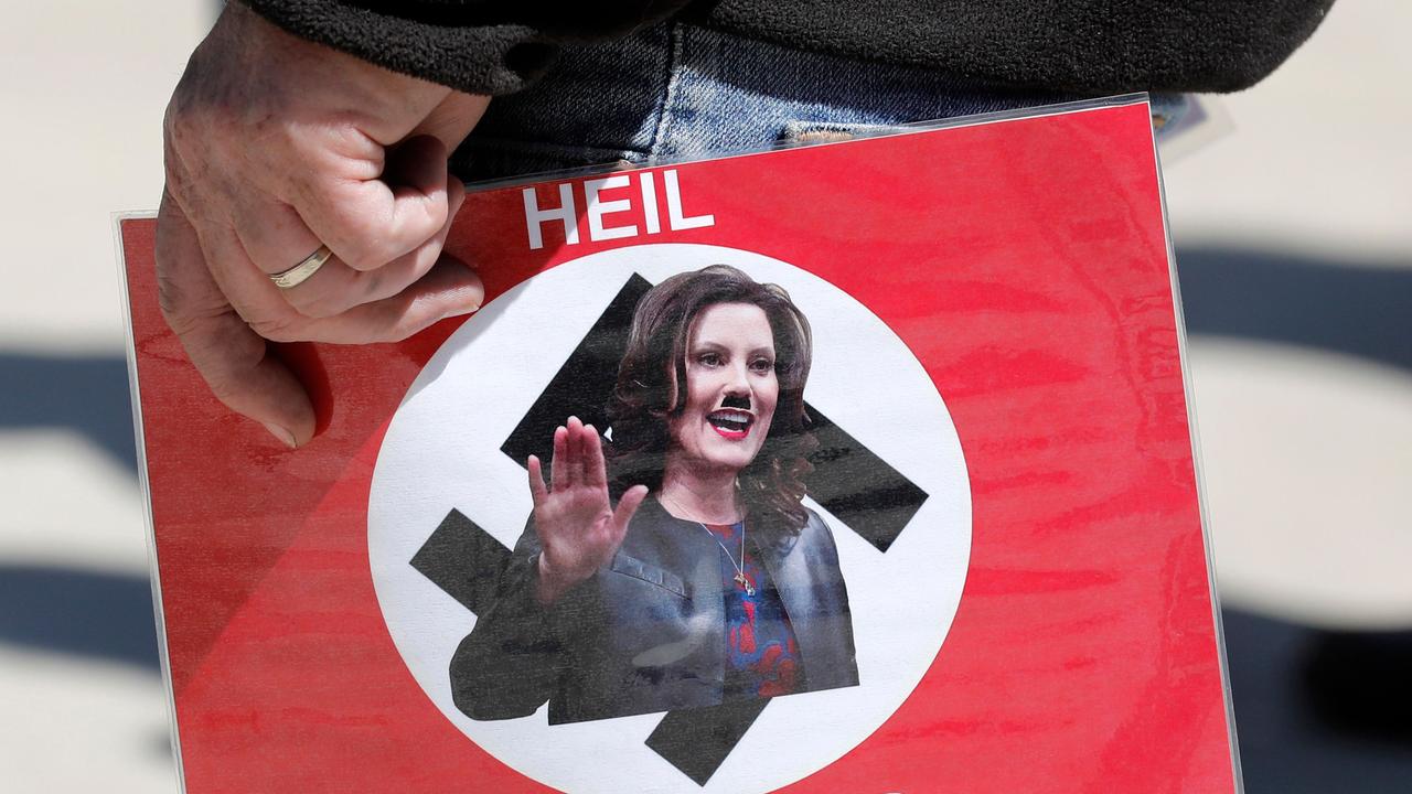 A home-made poster from May shows Michigan Governor Gretchen Whitmer being depicted as Adolf Hitler. Picture: Jeff Kowalsky / AFP