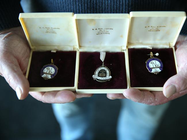 Phil Stringer with his collection of league best and fairest medals. Picture: Alison Wynd