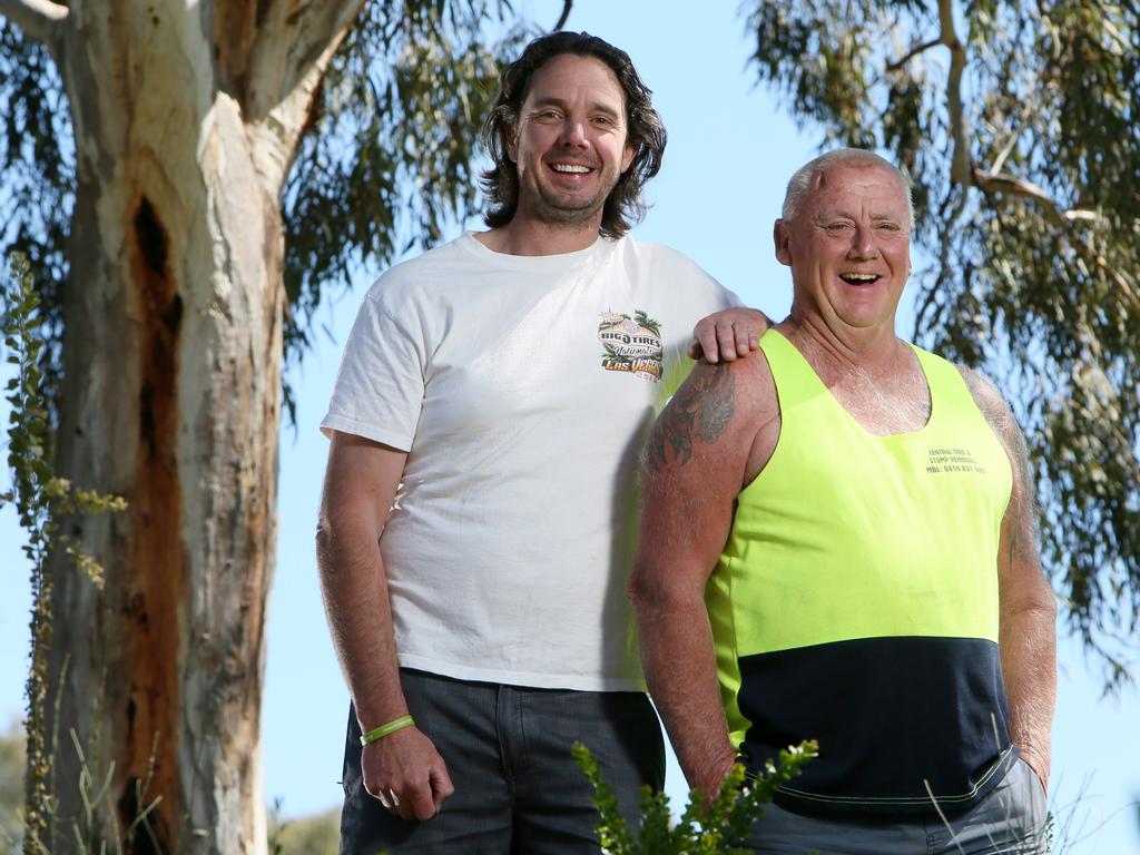 Pride of Australia. Nigel Hardy and Geoff Pinch catch up after the Birdsville track rescue, in the Oaklands Wetland Reserve, S.A. Nigel Hardy (White Shirt) pulled his friend Geoff Pinch (Fluro top)  rom boiling mud on the Birdsville track. (AAP/Emma Brasier)