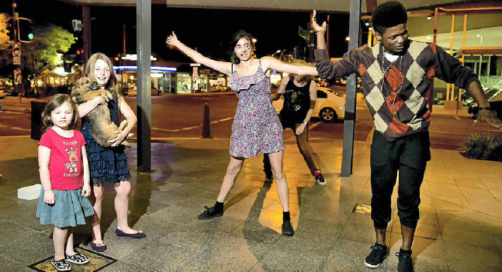 BREAK OUT: Kiyua Performing Arts flash mob crew (from left) Caitlin Webb, Rhiannon Williams, Frodo the dog, Breanna Lee and Franck Monsembula dance up a storm for a cause on Thursday night. Picture: Nev Madsen