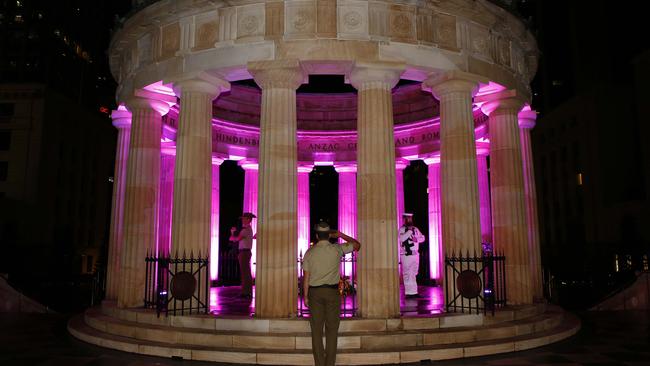 Soldiers stand around the eternal flame during the Anzac Day Dawn Service at the Shrine of Remembrance in ANZAC Square, Brisbane. Picture: NCA NewsWire/Tertius Pickard