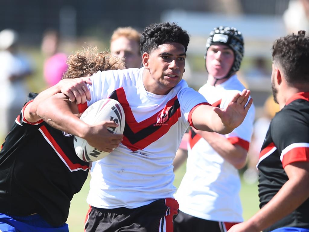 Boys Rugby League State Championship held at Northern Division, Brothers Leagues ground, Townsville. South West (black) v Wide Bay (white). 16-18 years. Noah Law of Shalom College.