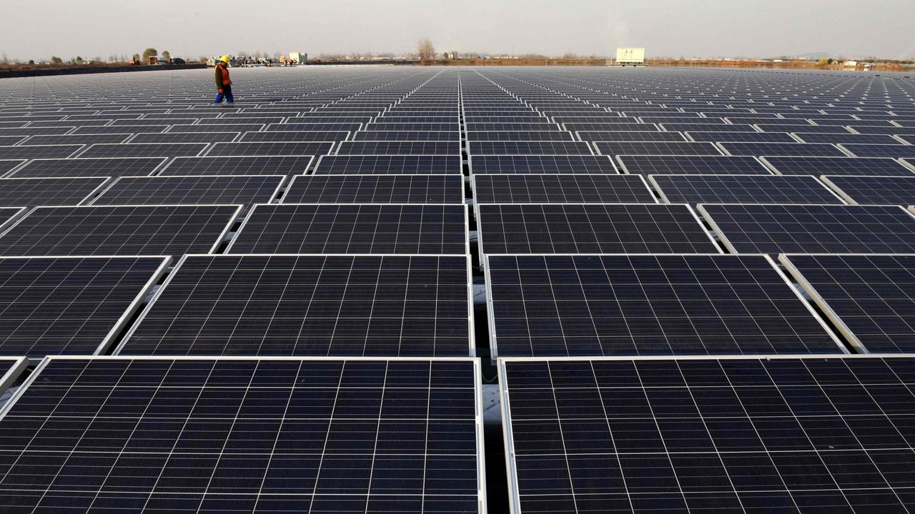 Nations are being encouraged to set ambitious emissions targets for COP26, including by investing in renewable energy sources such as solar power. This solar power plant is in Huainan, a former coalmining region of China. Picture: AFP