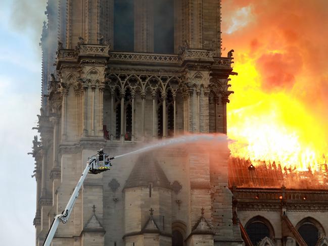 A firefighter is seen fighting the flames at Notre-Dame Cathedral April 15, 2019 in Paris, France. (Photo by Pierre Suu/Getty Images)