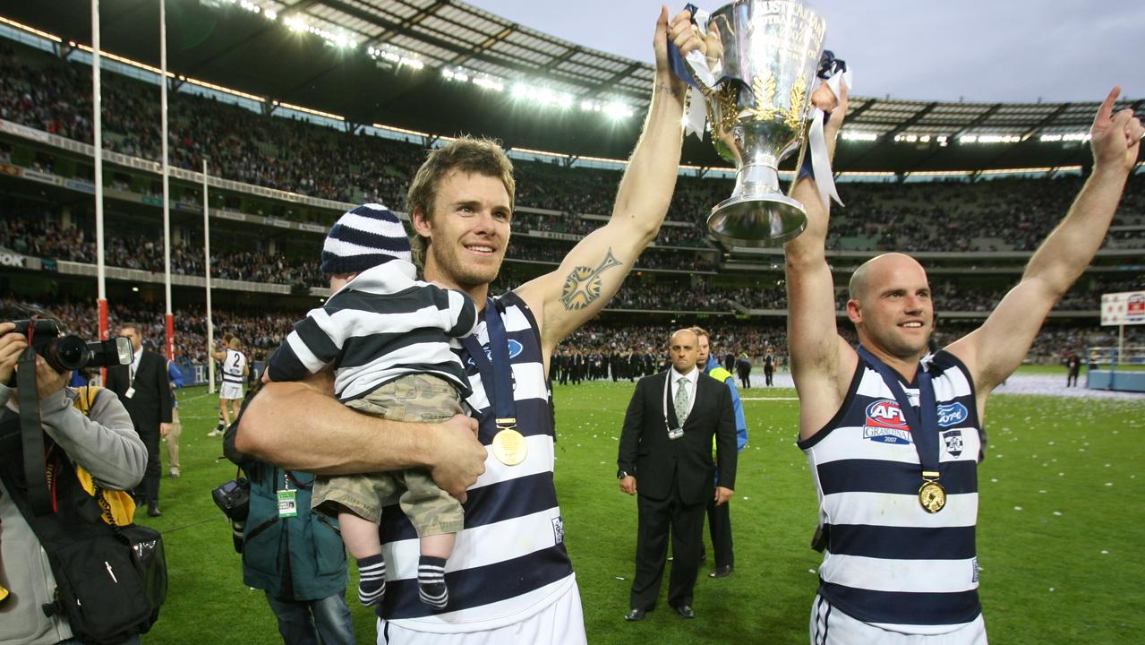Mooney, in 2007, enjoys the fruits of his labour with son Jagger and teammate Paul Chapman.