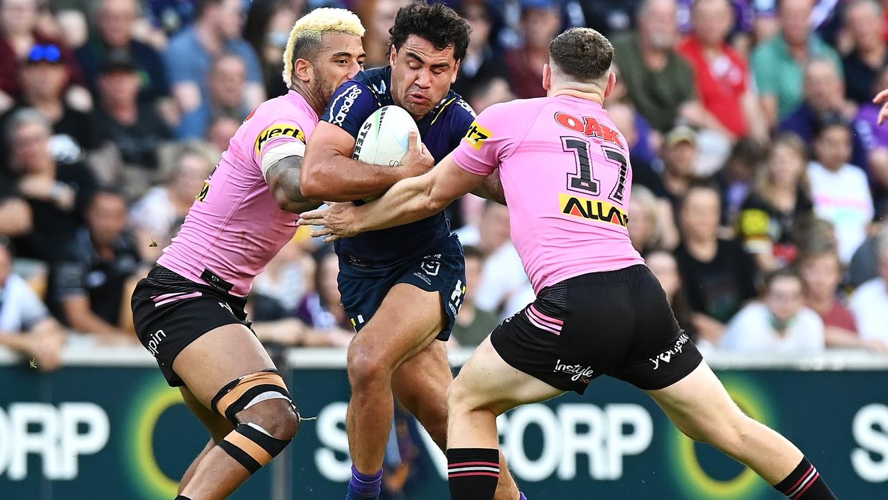 BRISBANE, AUSTRALIA - SEPTEMBER 25: Jahrome Hughes of the Storm is tackled during the NRL Preliminary Final match between the Melbourne Storm and the Penrith Panthers at Suncorp Stadium on September 25, 2021 in Brisbane, Australia. (Photo by Bradley Kanaris/Getty Images)