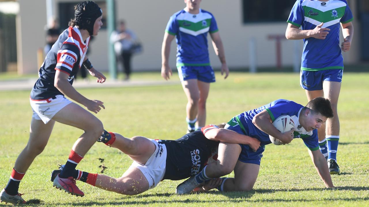 The Cathedral College's Noah Chadwick gets tackled.