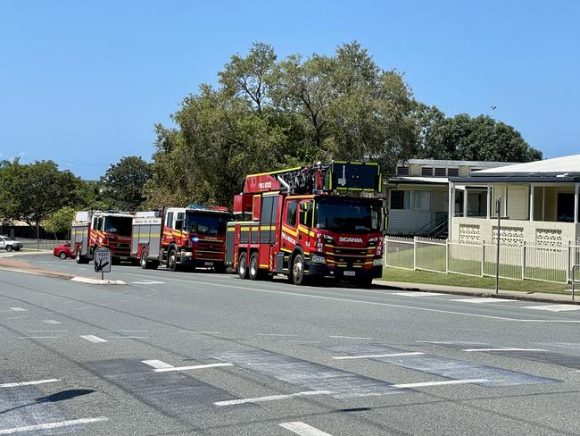 Students from Fitzgerald State School were evacuated onto a nearby oval following reports of smoke from one of the school's buildings. Photo: Fergus Gregg