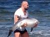 MMA fighter Cathal Pendred tries to save a dolphin. Picture: Twitter
