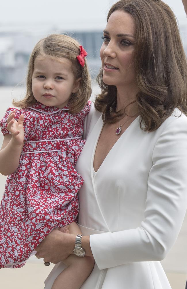 Princess Charlotte’s red sundress picked up on the Duchess’s ruby-red pendant. Picture: Getty Images