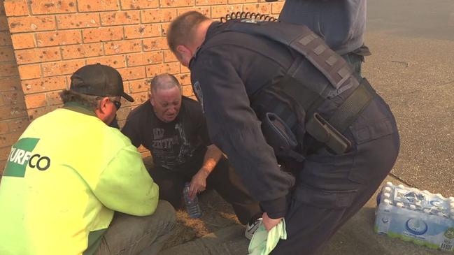 Treatment arrives for a man with smoke inhalation at Bomaderry. Picture: TNV