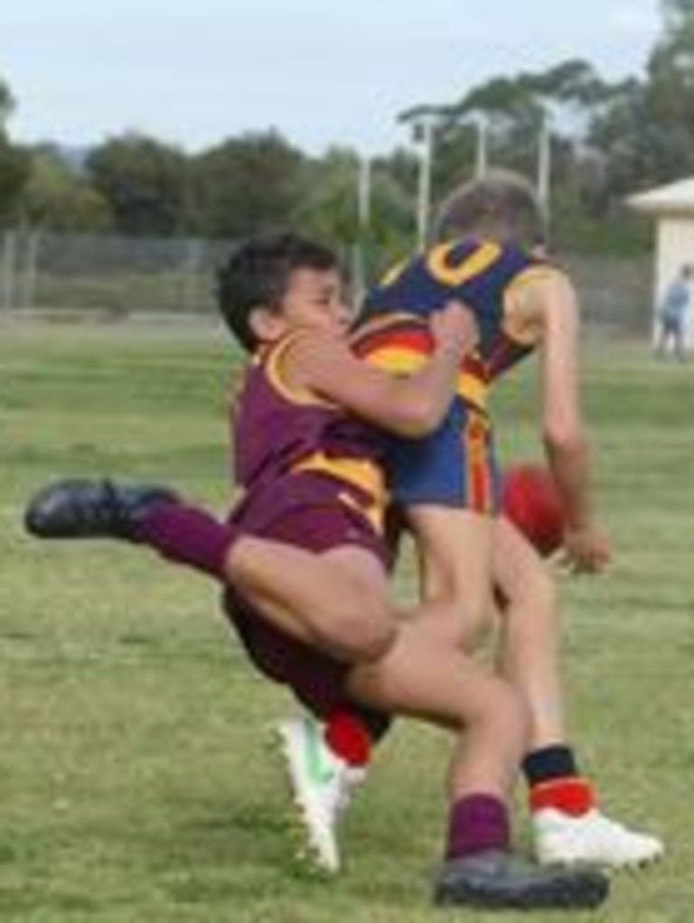 SA Little Legend Lucas Johncock, 12, is captured here representing Western Eyre Peninsula in the recent School Sport SA Sapsasa State Football Carnival. His skills are clearly on display as he tackles his Murray Mallee opposition player, showing he shares the sporting pedigree and determination of his AFL-playing uncle, Kade Chandler from the Melbourne Demons. Picture: Supplied.