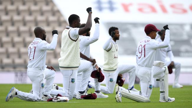 West Indies captain Jason Holder and his teammates take a knee before a Test in July