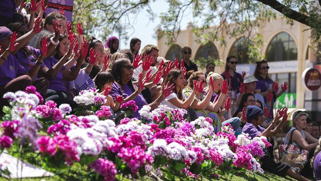 The 200-strong crowd outside Alice Springs Court House joined a Territory-wide day of action in Tuesday calling for domestic violence funding reform.