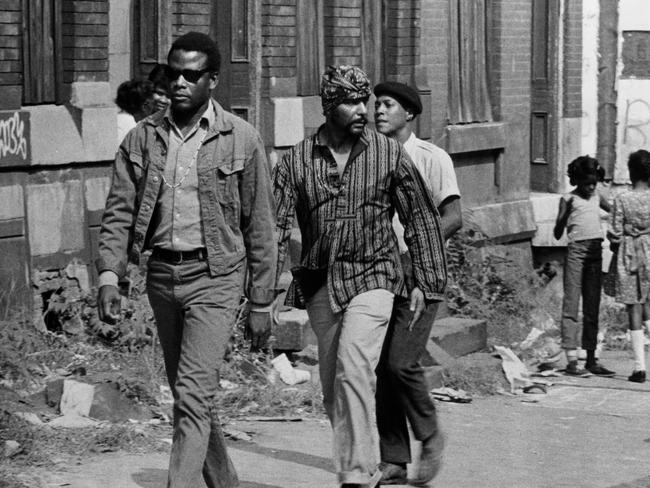 Sidney Poitier, Bernie Hamilton and Leon Bibb walk down the street in a scene from the film 'The Lost Man', 1969. Picture: Universal/Getty Images