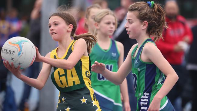 Action from the under-15 clash between Mid Hills 1 and Western Eyre at the Netball SA Country Championships. Picture: Russell Millard