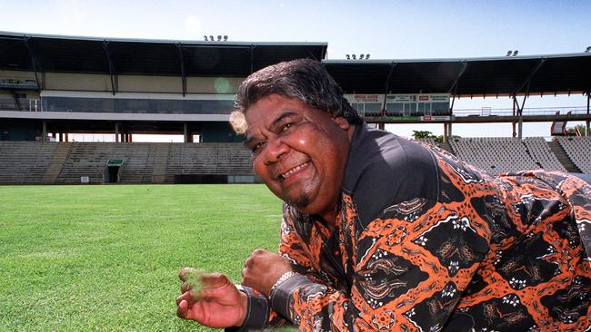 Sports Minister John Ah Kit gets a feel of the new Marrara turf yesterday. Maintaining the oval will cost up to $150,000 a year.