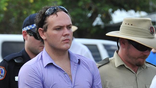 Zak Grieve, flanked by NT Police officers and guards,  visits the crime scene where Ray Niceforo was murdered