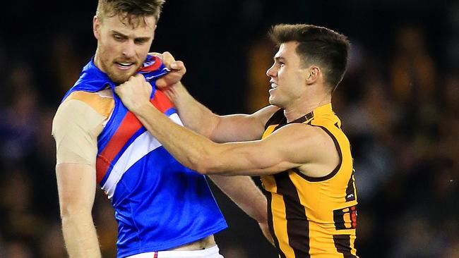 Jaeger O'Meara gets up close with Jordan Roughead. Picture: Mark Stewart