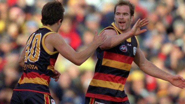 Mark Ricciuto celebrates a goal for the Crows.