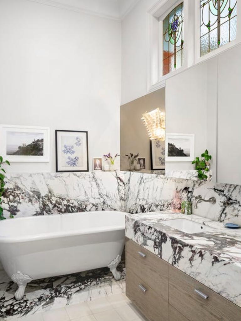 Another marble-fitted bathroom, this one with leadlight windows.