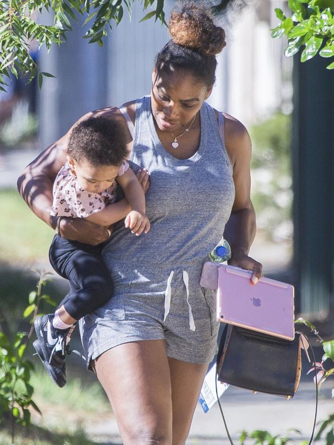 Serena Williams and her husband Alexis Ohanian enjoy an afternoon walk with their 1-year-old daughter Alexia Olympia. Serena's daughter looked seriously cute, toddling her way down the footpath, wearing Nike sneakers like her Mummy. Picture: MediaMode