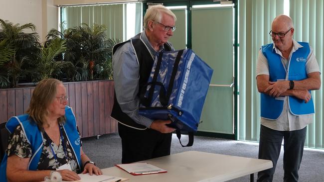 Coffs Harbour election manager John Clark gives the ballot box a good shake. Picture: Chris Knight