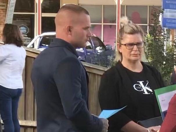 Jayden Reed (left) speaking to his lawyer with a female supporter outside Picton Court.