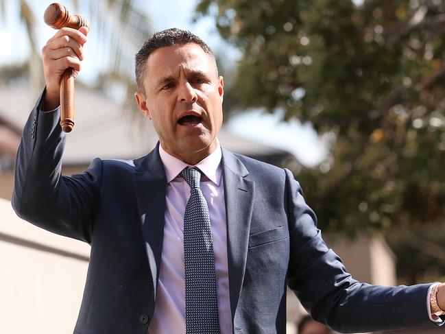 SUNDAY TELEGRAPH - 13/10/18East auction at 12 Murriverie Rd, North Bondi which was boufght by married couple Keiran Faulkner and Joujou Faulkner. Auctioneer Jason Pantzer pictured selling the house.  Pic, Sam Ruttyn