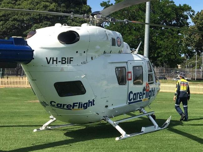 A CareFlight helicopter landed in St Leonard's Park, North Sydney, to treat a man seriously injured in a motorcycle incident on the Warringah Freeway. Picture: CareFlight