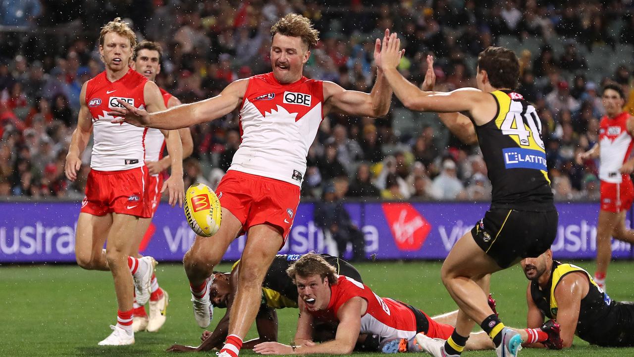 ADELAIDE, AUSTRALIA – APRIL 14: Will Gould of the Swans and Tyler Sonsie of the Tigers during the 2023 AFL Round 05 match between the Sydney Swans and the Richmond Tigers at Adelaide Oval on April 14, 2023 in Adelaide, Australia. (Photo by Sarah Reed/AFL Photos via Getty Images)