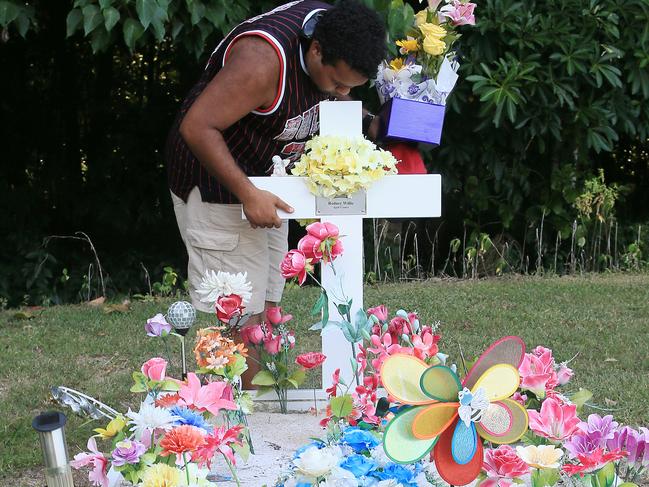 Lewis Warria visits the graves of his younger brothers, sisters and niece.