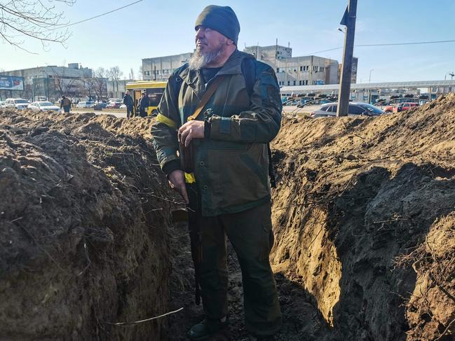 A Kyiv resident and volunteer prepares a rear post with trenches in Kyiv. Picture: AFP