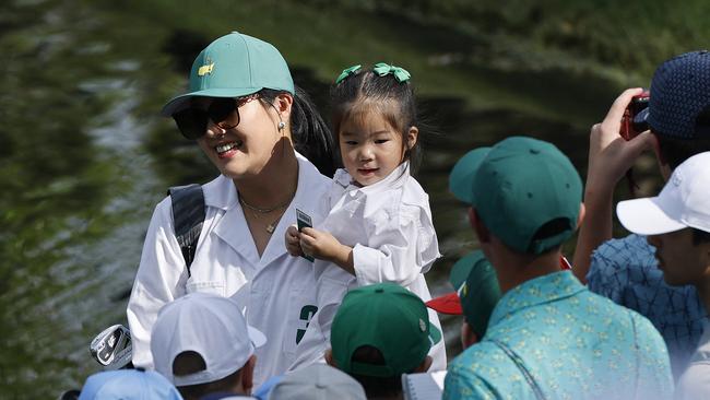 Jamie Heejae An, wife of Byeong Hun An of Korea, carries their daughter, An Ji-woo. Picture: Getty