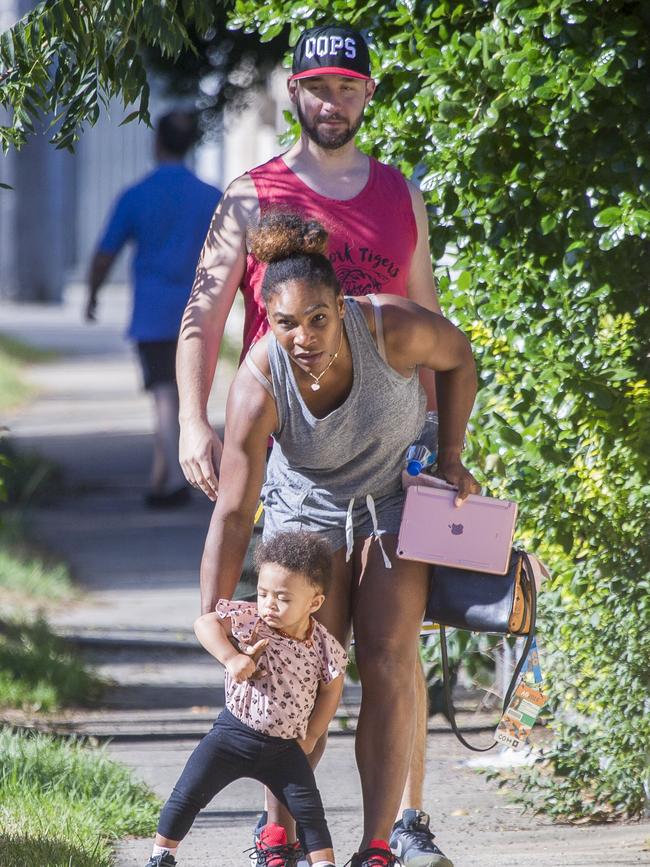 Serena Williams and her husband Alexis Ohanian enjoy an afternoon walk with their 1-year-old daughter Alexia Olympia. Serena's daughter looked seriously cute, toddling her way down the footpath, wearing Nike sneakers like her Mummy. Picture: MediaMode