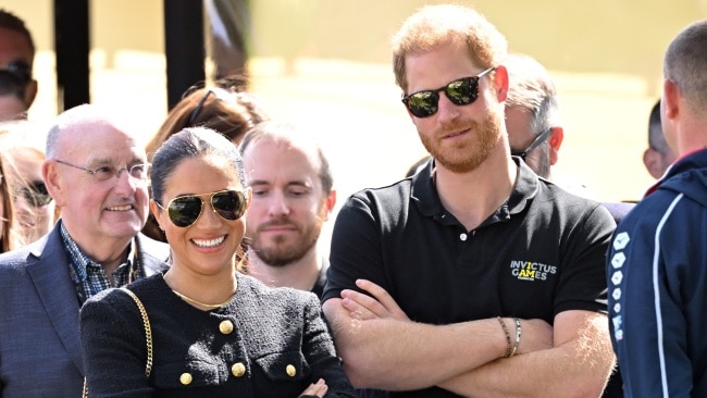 One of the most respected authors on the royal family claims Prince Harry is "obsessed" with Meghan Markle. Picture: Karwai Tang/WireImage/ Getty Images.