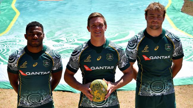 Wallabies players show off their new Indigenous-designed jerseys.