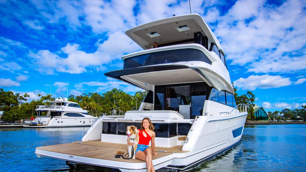 Paris Lightfoot and her pooch Ziggy on a Maritimo Luxury Motor Yacht. Picture: Nigel Hallett