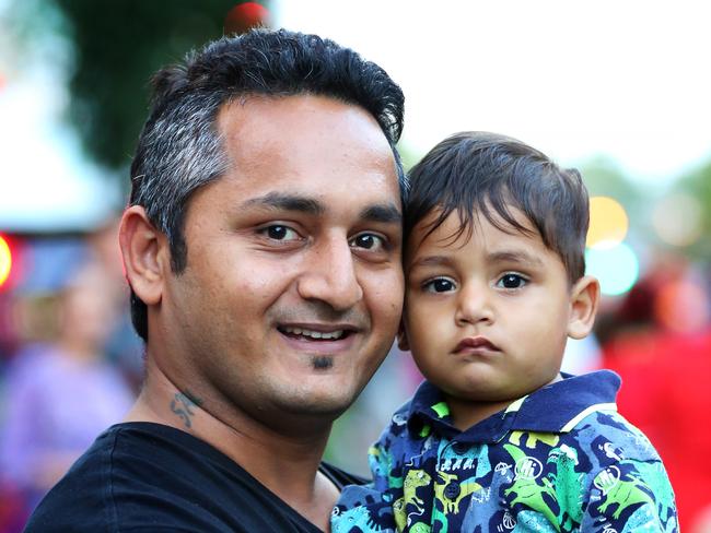 Sumanshu and his daughter Abeer Arora, 1, enjoying the Welcome Parade.