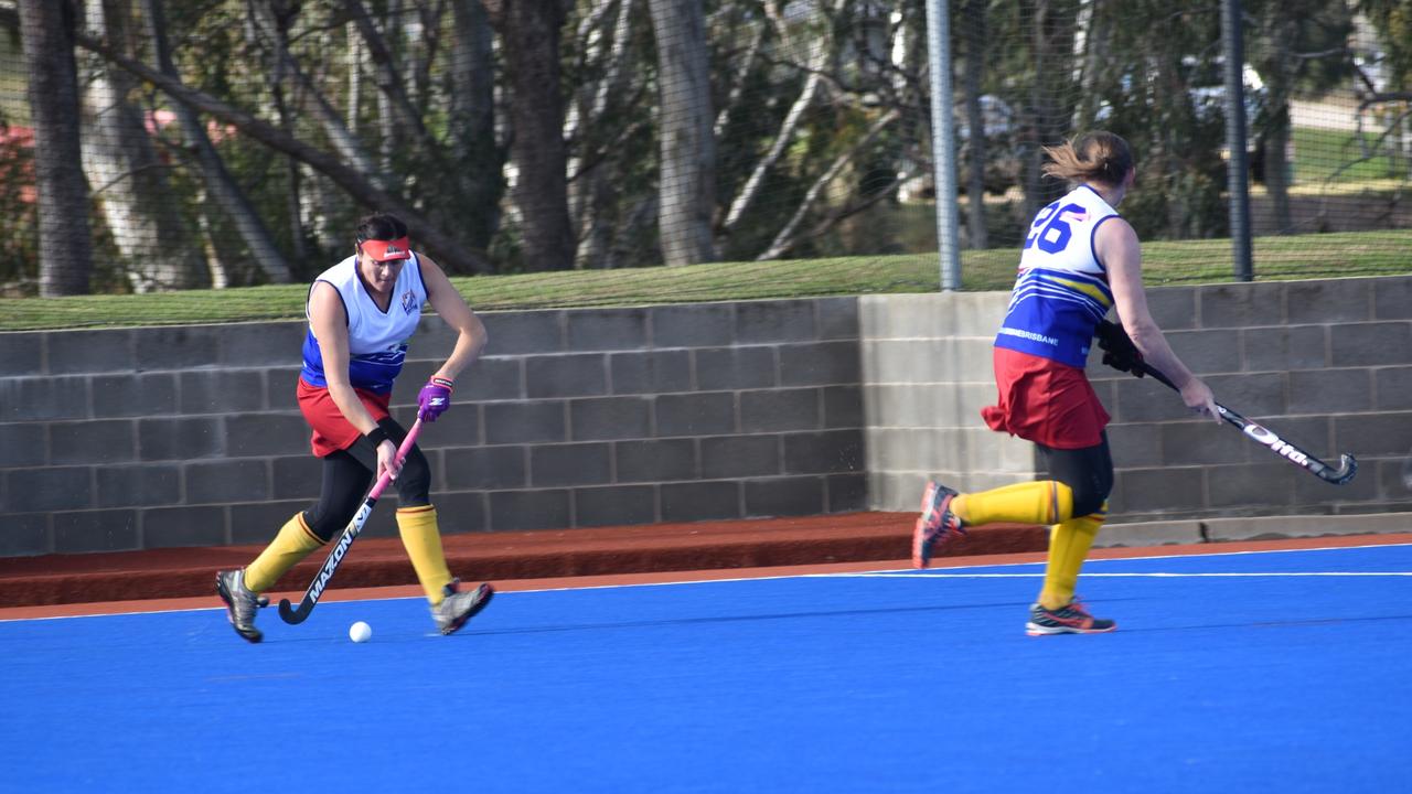 Monique Nacsa in possession for Brisbane in their match-up with Maryborough at the 2021 Queensland Hockey Women's Masters Championships.