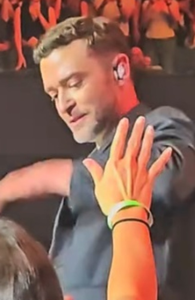 Justin Timberlake was caught on camera growing frustrated with a fan before slapping away their hand with his hand. Picture: TikTok.