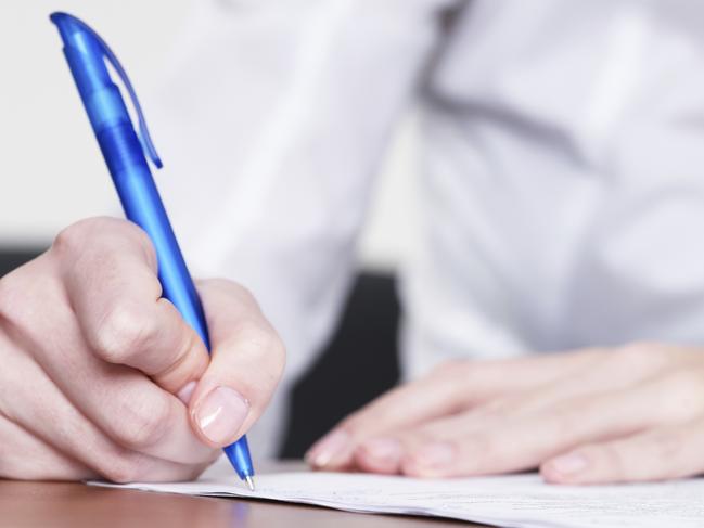 Writing a letter. person using a pen to write a letter. stock image. Picture: ThinkStock