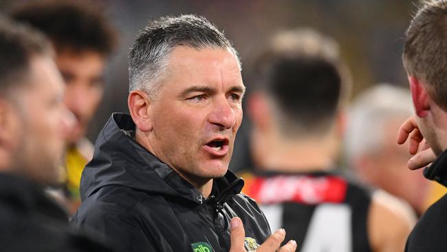 MELBOURNE, AUSTRALIA - MAY 25: Adem Yze, Senior Coach of the Tigers speaks at three quarter time during the round 11 AFL match between Richmond Tigers and Essendon Bombers at Melbourne Cricket Ground, on May 25, 2024, in Melbourne, Australia. (Photo by Morgan Hancock/AFL Photos/via Getty Images)