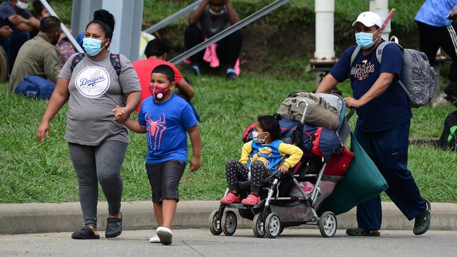 A family joins the caravan in San Pedro Sula, Honduras. Picture: AFP