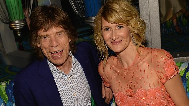 Mick Jagger poses with actor Laura Dern. Photo: Michael Buckner/Getty Images