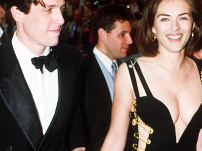 11/05/1994. File picture of actors Hugh Grant and Elizabeth Hurley supplied by (c) UPPA. Premiere of Four Weddings and a Funeral. Liz Hurley. Versace. Safety pin dress.