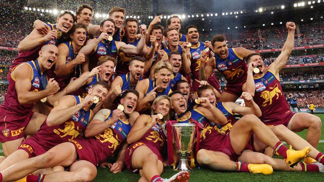 Brisbane Lions players celebrate winning the AFL Grand Final after defeating the Sydney Swans at the MCG. Picture Lachie Millard