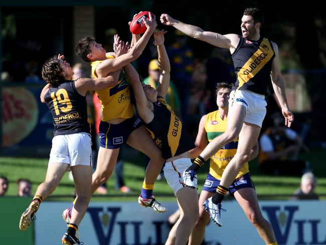 The Eagles’ Andrew Ainger tried to mark as he is surrounded by Glenelg players. Picture: Tait Schmaal