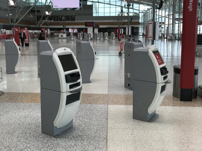 Coronavirus fears have impacted travelers within Australia with Qantas canceling services and the domestic airport nearly empty during Tuesday afternoon. Picture: Toby Zerna