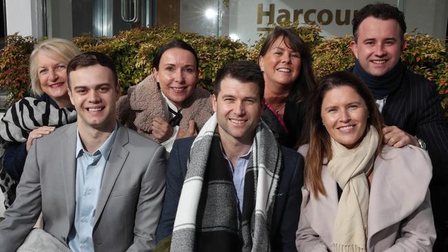 Harcourts Coastal sales director Rob Forde (middle with scarf ) and his team are joining the Vinnies CEO Sleepout on June 17. Picture Glenn Hampson